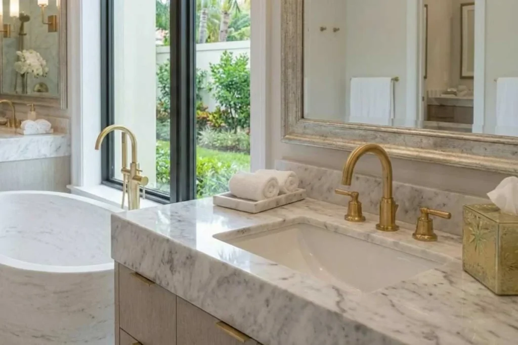 Luxury bathroom design with marble walls, freestanding bathtub, and modern lighting